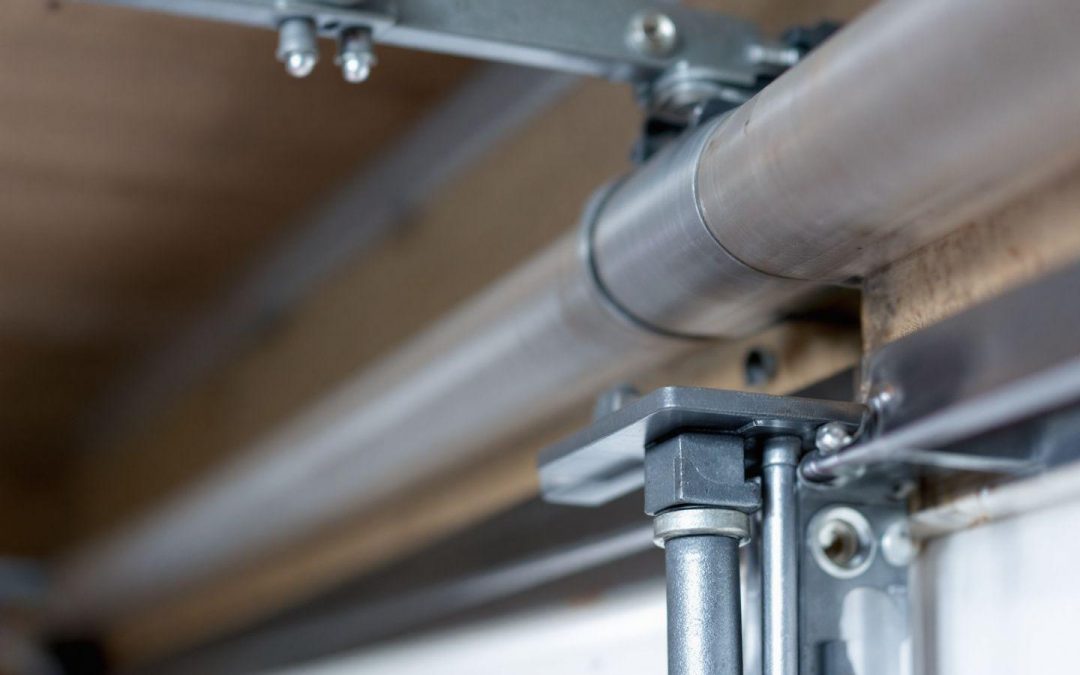 Ressort pour porte de garage sectionnelle de traction et torsion